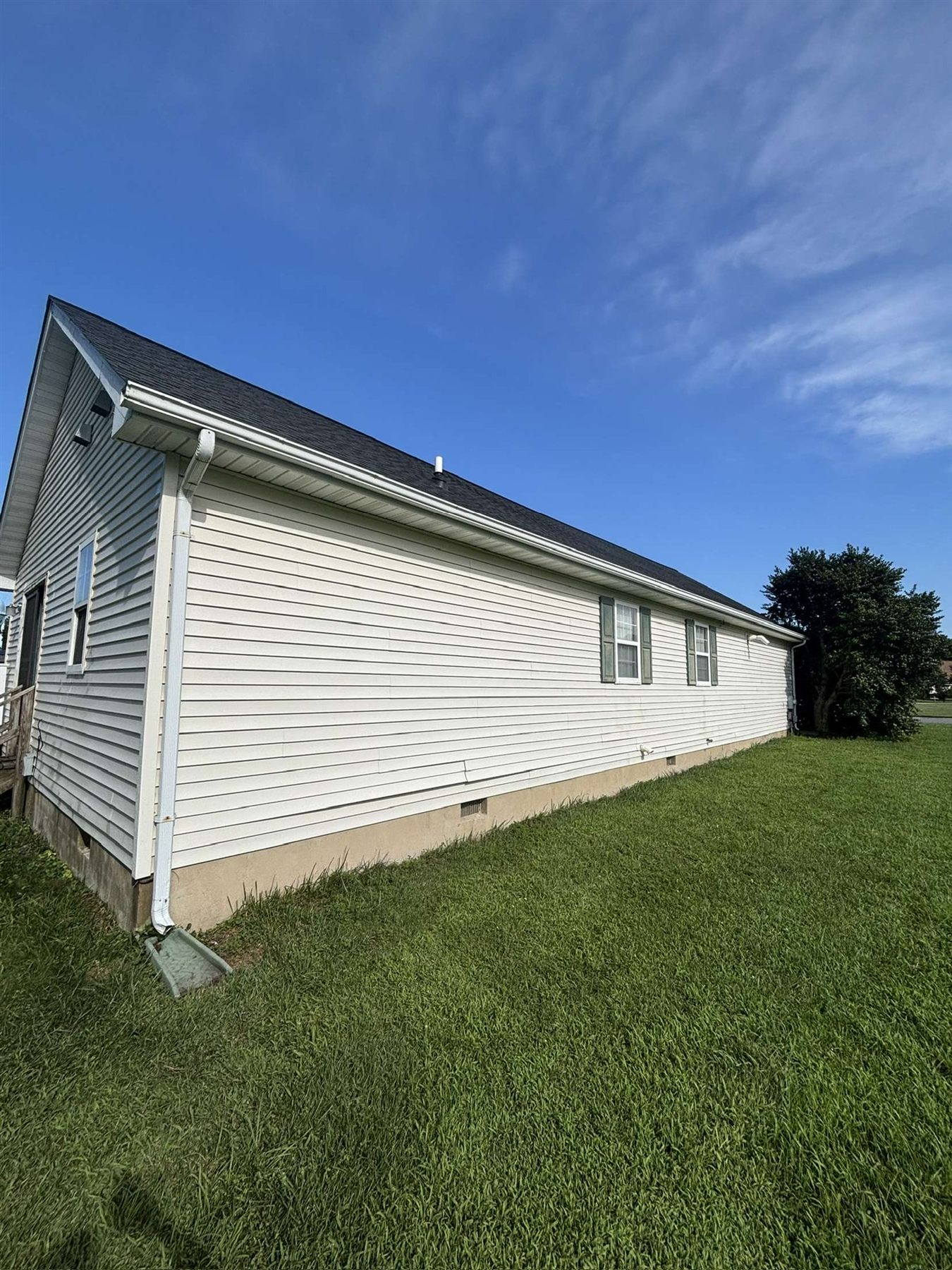 After house wash showing clean siding in Milford Delaware